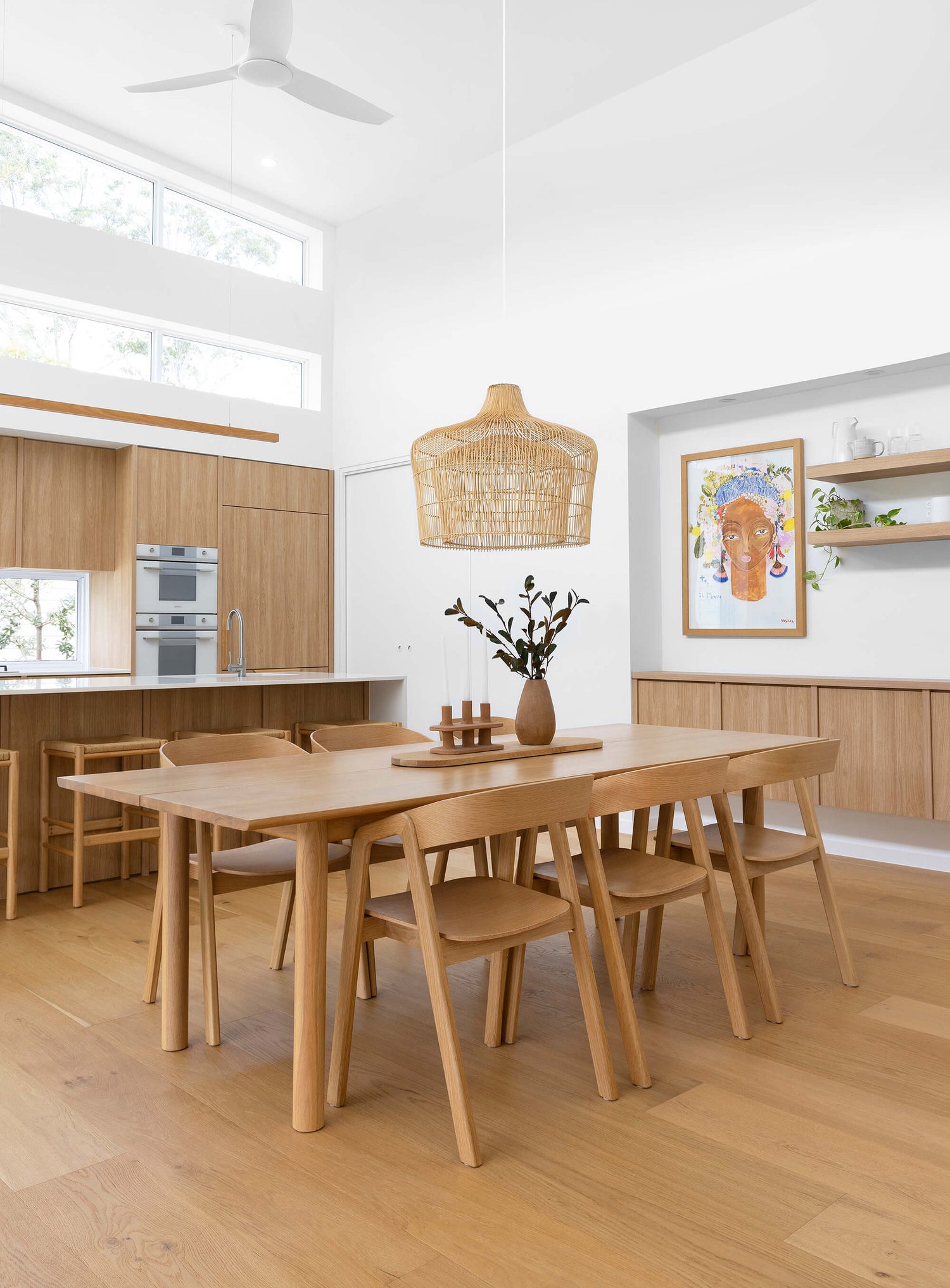 Henley dining room pendant light hangs abvoe a six-seater rectangular timber dining table.