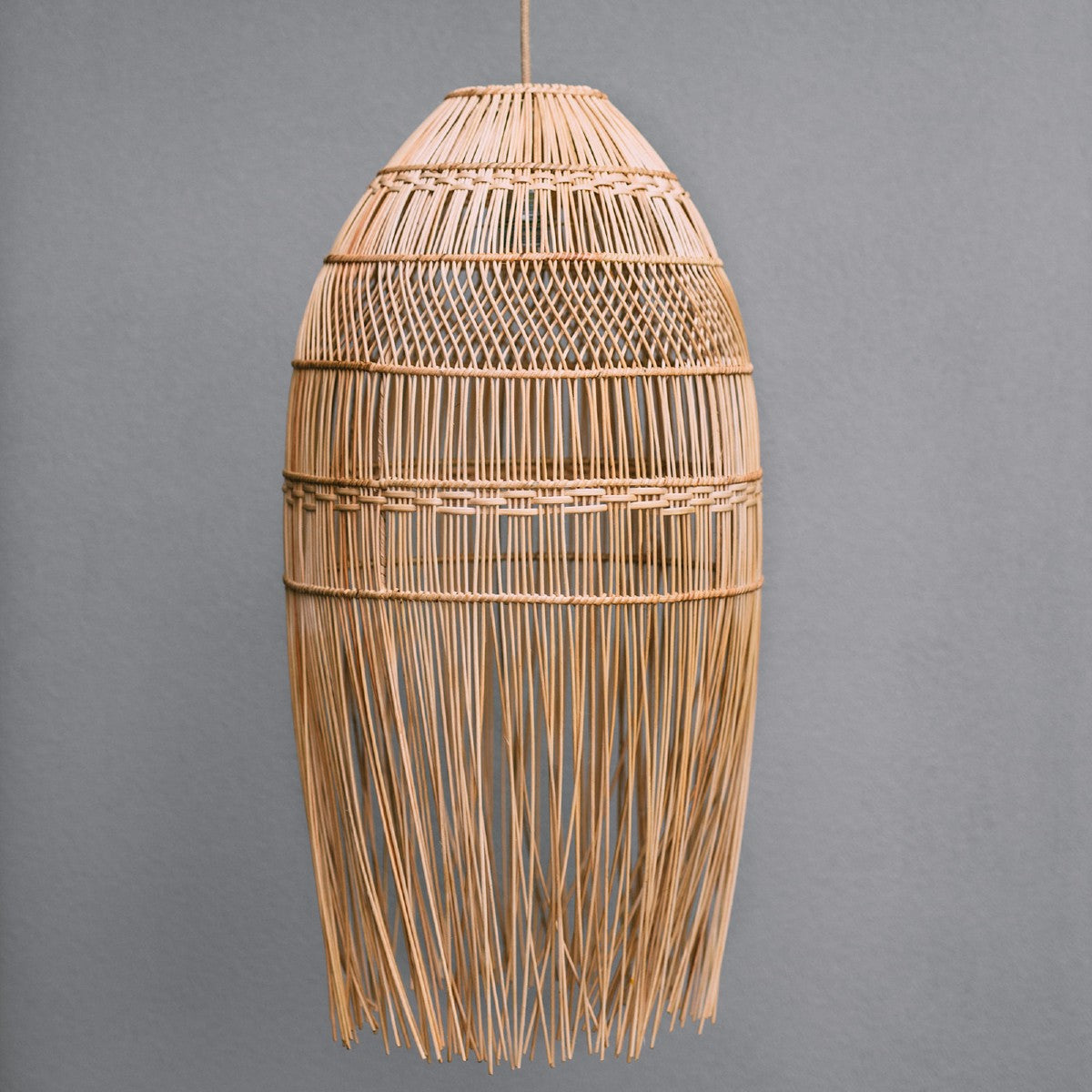 boho lighting. rattan boho lighting. beautiful rattan lighting with fringe detail at the bottom