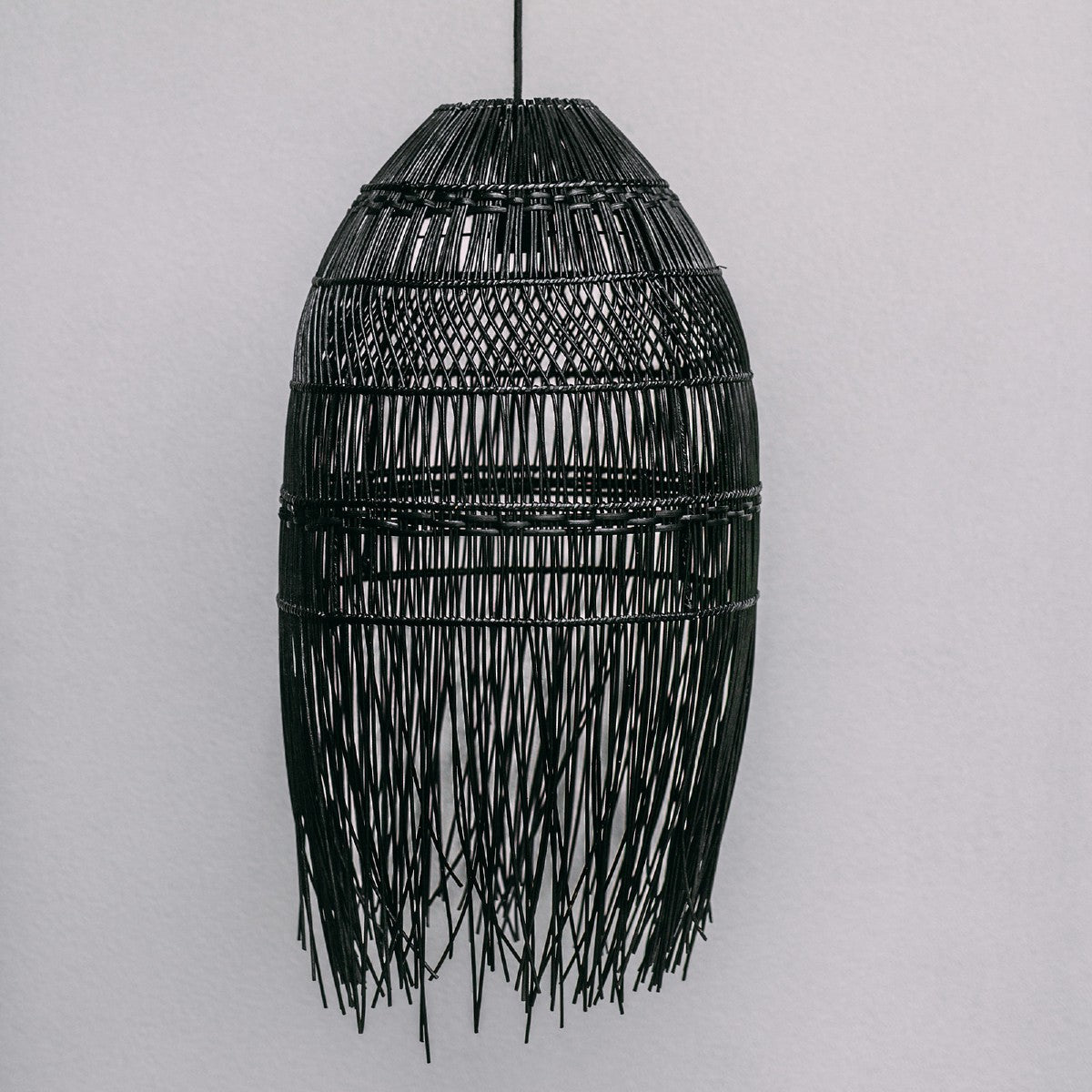 rattan boho lighting. handwoven boho lighting shows the pattern of the bondi pendant.