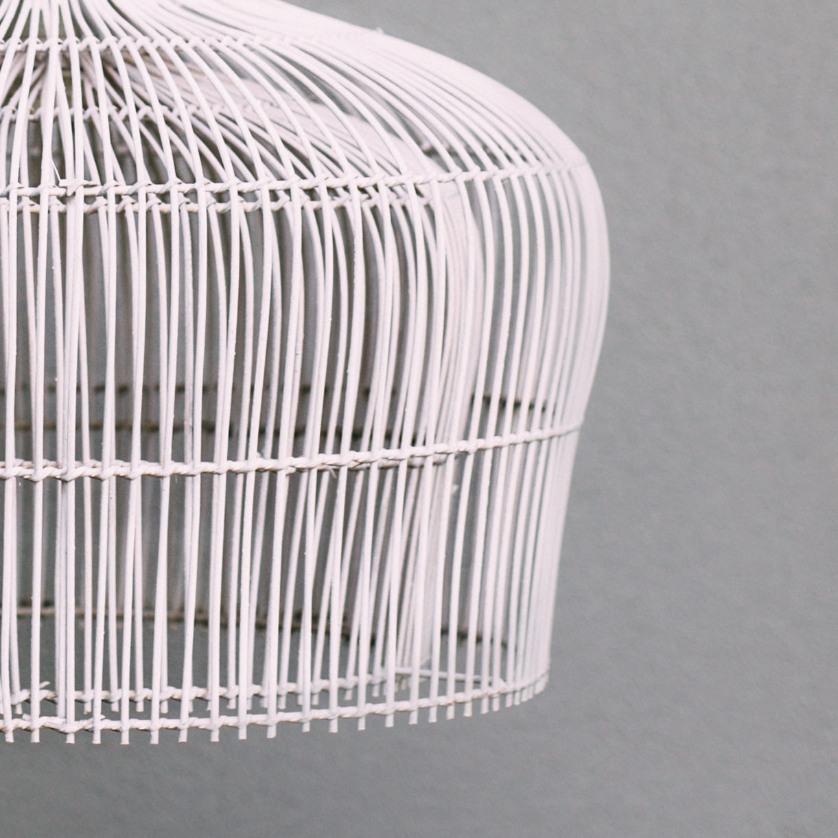 Close-up-photo-of-Coastal-style-lighting-option-double-layered-white-rattan-pendant-light-showing-detail