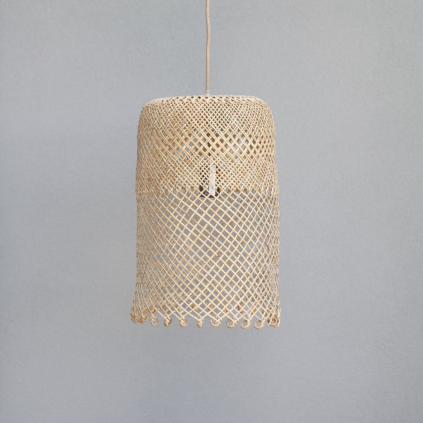 photo-of-Natural-coastal-boho-style-lighting-showing-a-medium-borneo-basket-light-shade-with-open-weave-and-ring-detail-at-the-bottom