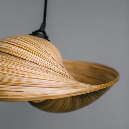 side-view-showing-curved-detail-of-bamboo-pendant-light-shade-made-from-thin-strips-of-bamboo-to-look-like-a-shell