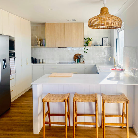 Portsea feature pendant light over a white kitchen bench. This kitchen was thoughtfully designed by Molino Interiors.