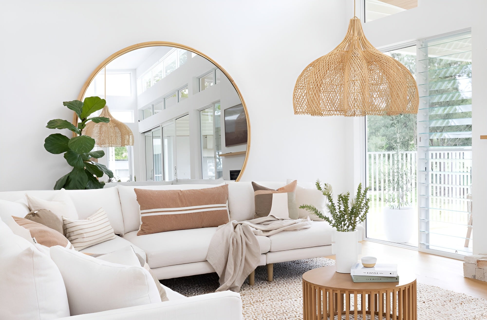 Whitehaven XL statement light hanging in a coastal living room.