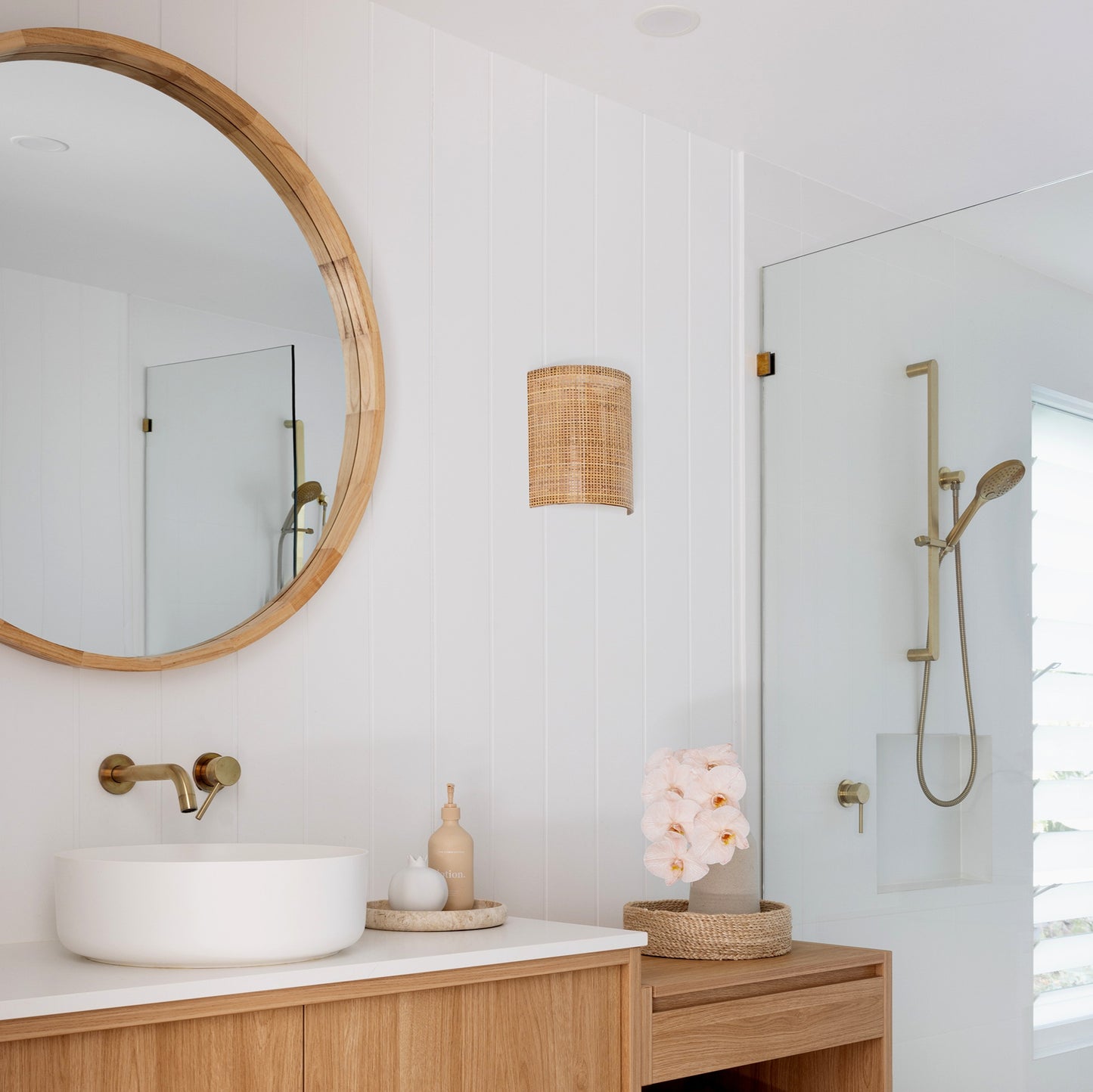 curved rattan wall light in bathroom