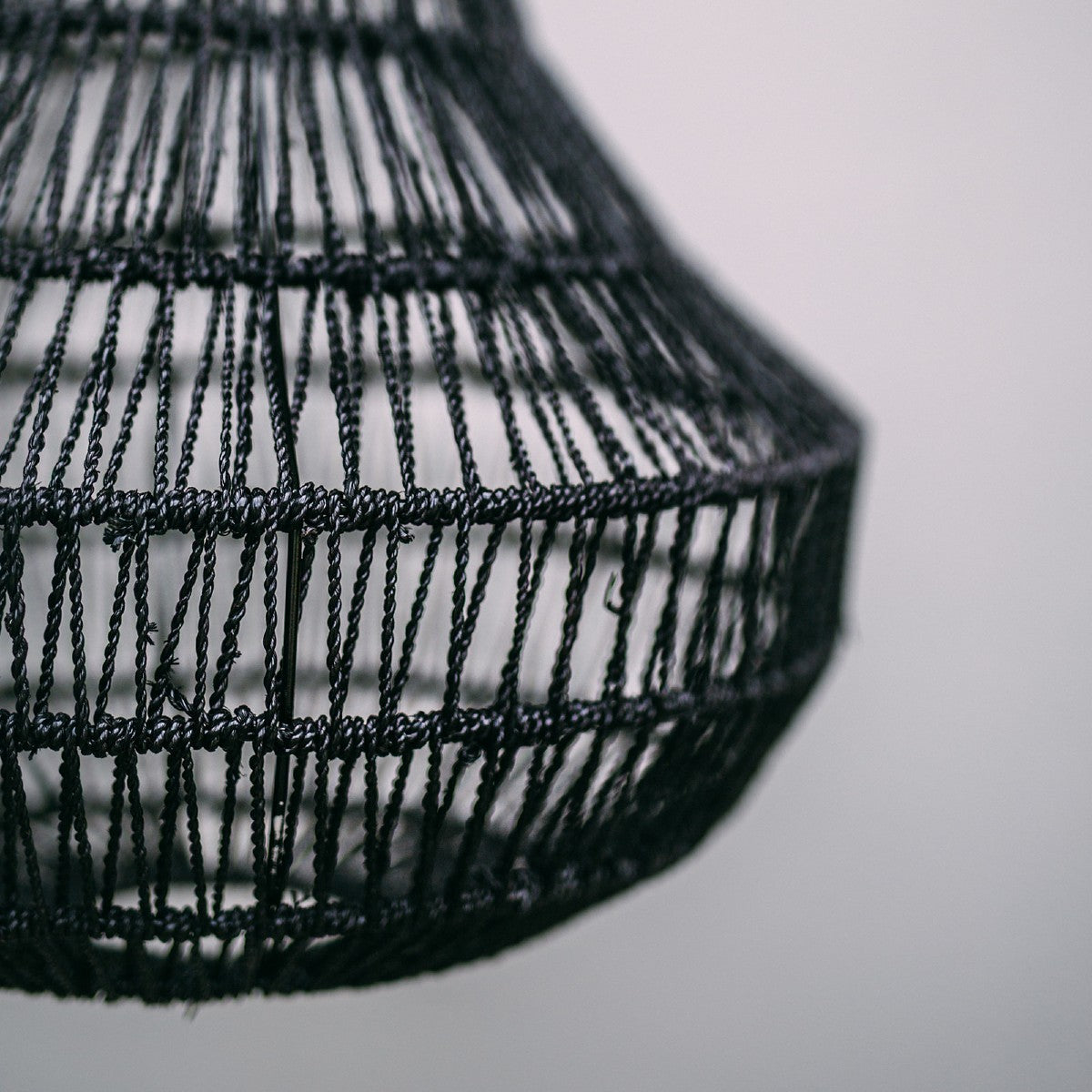 Hamptons seagrass pendant light. image shows close up detail of the seagrass twine woven arounnd the light shade frame.