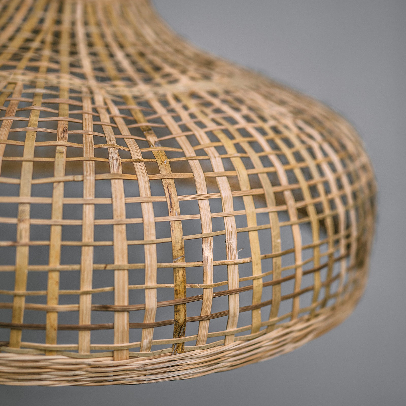 Bamboo pendant light. Close-up-photo-of-Coastal-Hamptons-lighting-style-natural-bamboo-pendant-light-showing-detail-in-open-weave-design