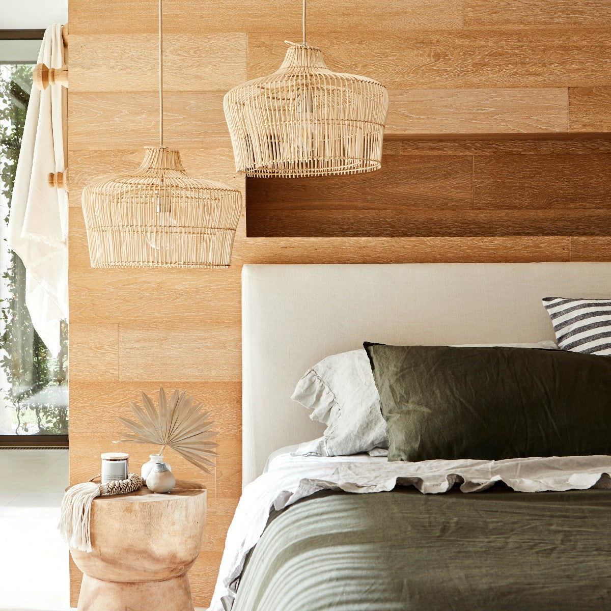 lifestyle-photo-of-2-coastal-style-double-layered-pendant-lights-suspended-as-bed-side-lights-above-a-bed-with-olive-green-linen