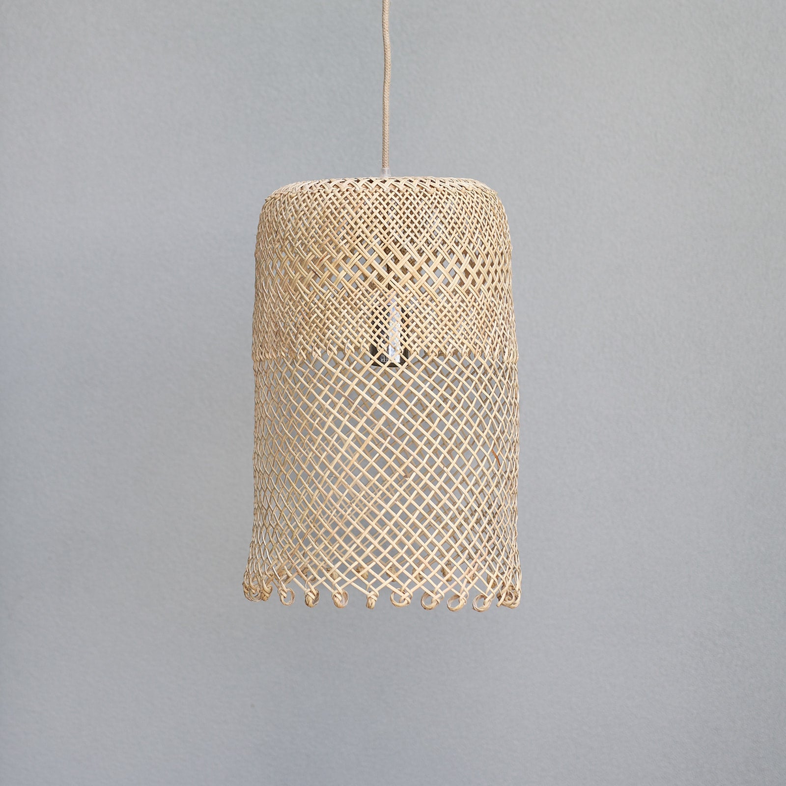 photo-of-Natural-coastal-boho-style-lighting-showing-a-medium-borneo-basket-light-shade-with-open-weave-and-ring-detail-at-the-bottom