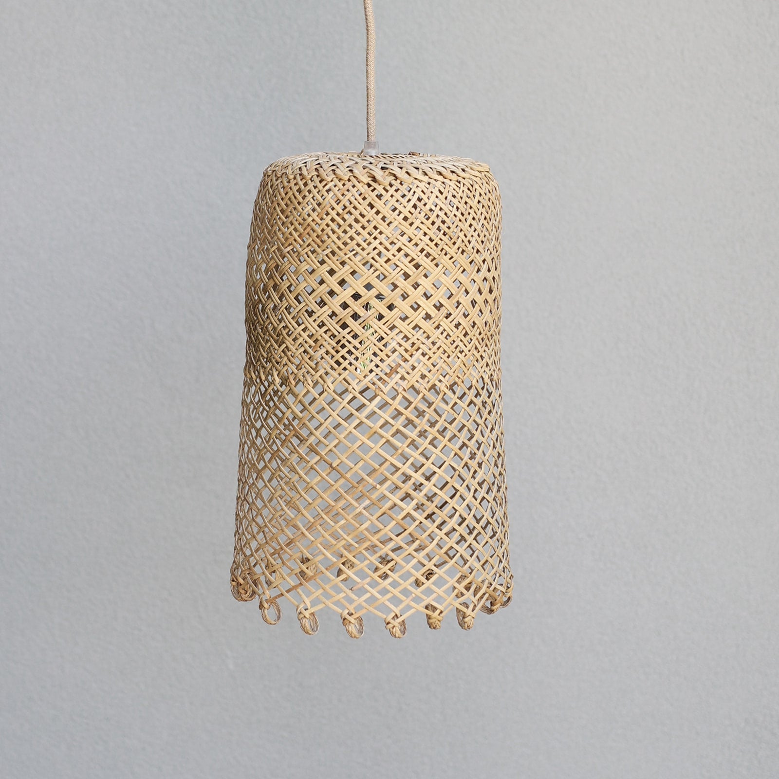 photo-of-Natural-coastal-boho-style-lighting-showing-a-small-borneo-basket-light-shade-with-open-weave-and-ring-detail-at-the-bottom